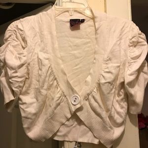 Cardigan only goes past the breast